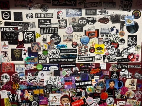 Sticker-covered wall in the venue